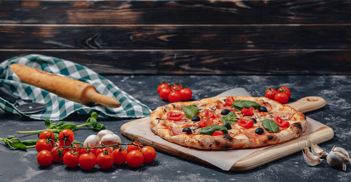 delicious-neapolitan-pizza-on-board-with-cherry-tomatoes-free-space-for-text-1.jpg
