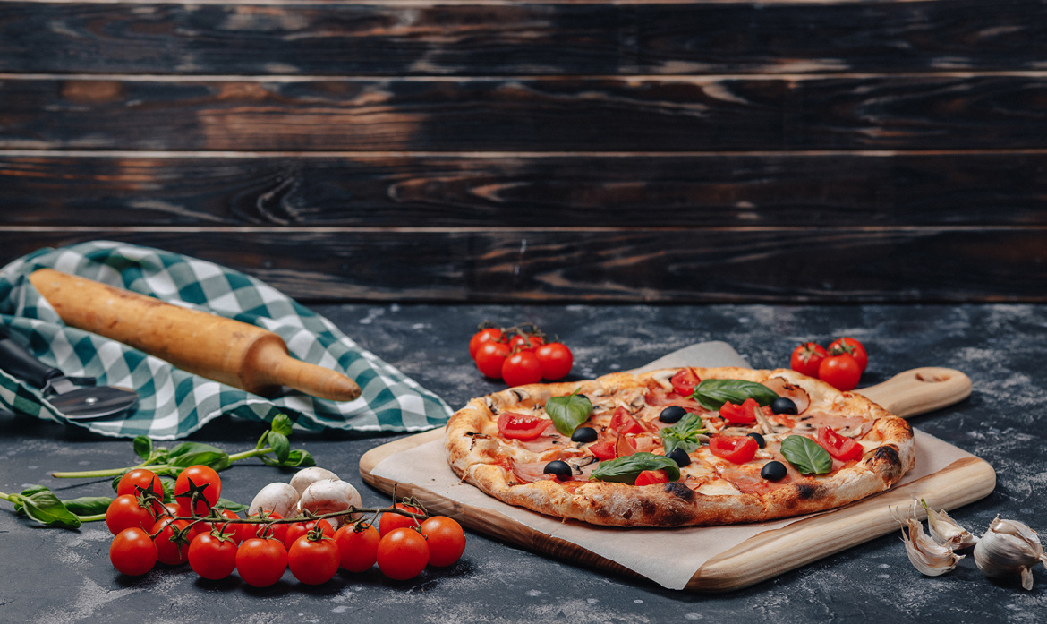 delicious-neapolitan-pizza-on-board-with-cherry-tomatoes-free-space-for-text-2.jpg